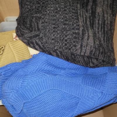 Vintage men’s clothing, including sweaters.
