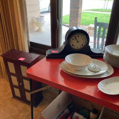 Mantle clock & photo armoire on floor