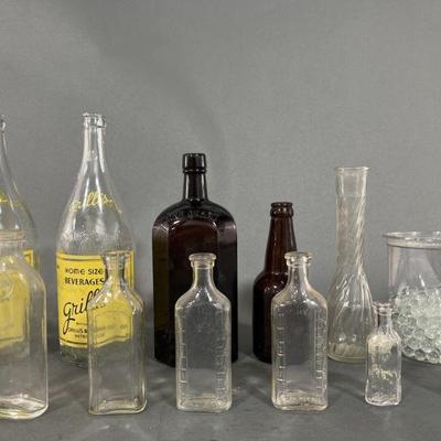 Lot 41 | Glass Bottles and Clear Marbles Some Vintage