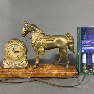 Lot 61 | United Electric Clock and Brass Candle Lights