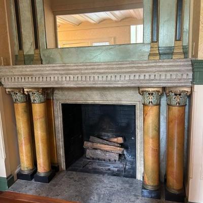 stone and wood column fireplace surround