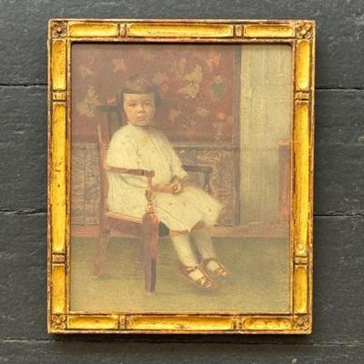 Antique portrait of a seated child. Circa early 1900’s. This appears to be a hand colored photograph. Chinoiserie wallpaper in the...