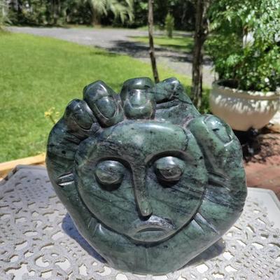 Hand carved stone sculpture signed by the artist 
