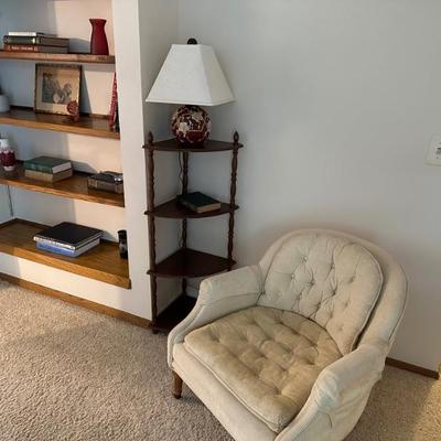 Cream fabric chair, 3-tier corner shelf unit, lamp, bookcase items