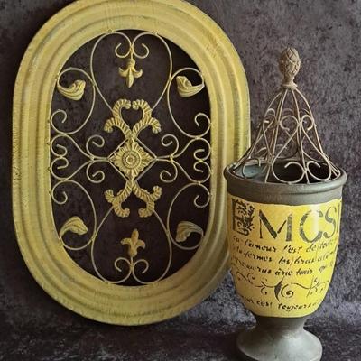Old World Style Scrolled Metal Wall Hanging And Pottery Urn With Metal Top