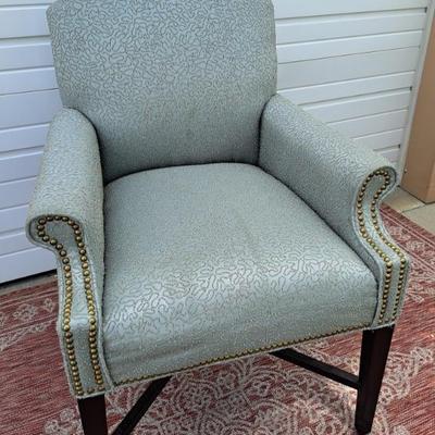 Beautiful Aqua Color Occasional Chair With Dark Wood Legs And Nail Studs