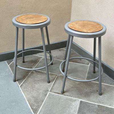 (2PC) PAIR METAL STOOLS | Round metal stools with wood top and ring footrest. - h. 24 x dia. 16.5 in

