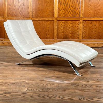 LEATHER MODERN CHAISE LOUNGE | Square patterned leather curved lounger with a mirrored steel frame. - l. 66 x w. 28 x h. 33.5 in


