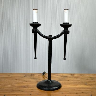 MANNER OF DIEGO GIACOMETTI TWO LITE TABLE LAMP | Having hammered metal exterior with 2 faux candle fixtures. - l. 10.5 x w. 6.5 x h. 19.5...