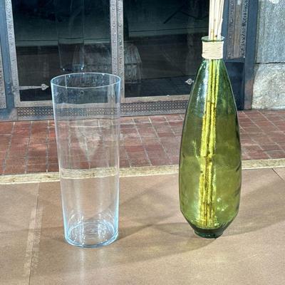 (2PC) MONUMENTAL GLASS VASES | Includes: Anne Nilsson hand-blown clear glass cylindrical vase, and large green glass vase.Green jug...