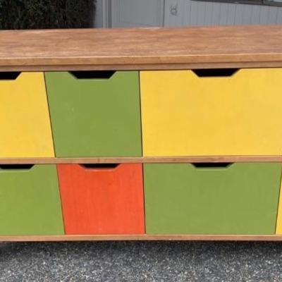 Cool wooden cabinet with colorful drawers 