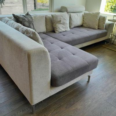 Plush designer sectional couch with chrome legs