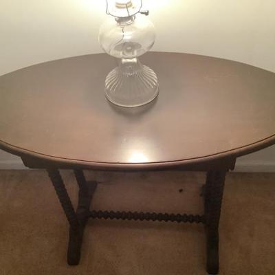$95- Oval shaped, twisted leg , wooden table 27