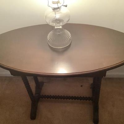 $95- Oval shaped, twisted leg , wooden table 27"H 39"L 20"depth