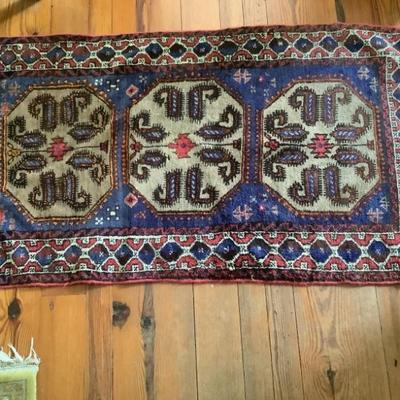 $125- hand-knotted rug 60" x 33"