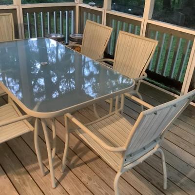$175- Patio table & 6 chairs, small holes on 2 chairs, table 28