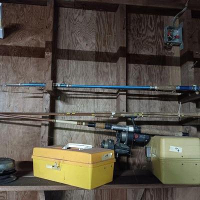 Antique fishing poles and miscellaneous fishing gear.