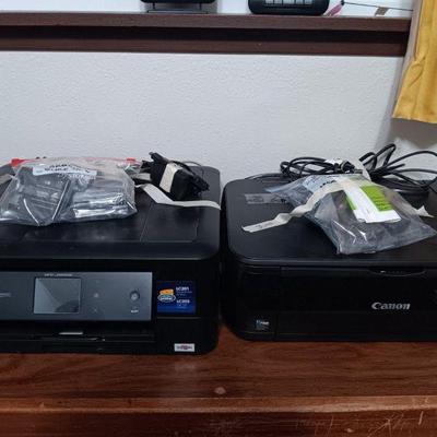 Two working inkjet printers with ink and supplies. 
