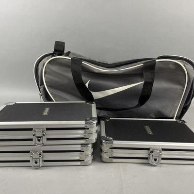 Lot 470 | 3 Vaultz CD Cases & Large Nike Duffle Bag
