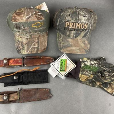 Lot 334 | 3 Hunting Knives, 2 Camo Hats and Camo Gloves
