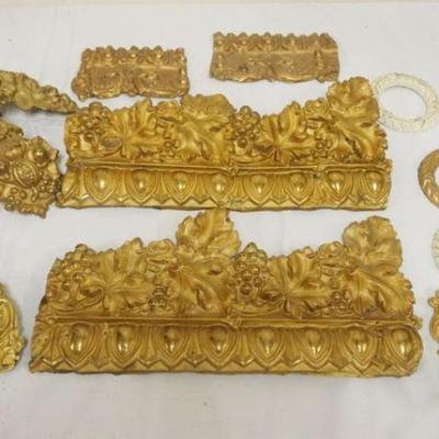 1102	GROUP OF ASSORTED ANTIQUE PRESSED BRASS ARCHITECTURAL ITEMS INCLUDING TRIM AND TIE BACKS
