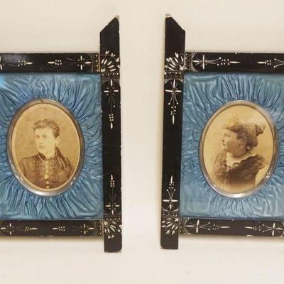 1032	PAIR OF EBONIZED VICTORIAN FRAMES W/ANTIQUE PORTRAIT PHOTOS HAVING SILK LINED MATTING, EACH APPROXIMATELY 9 IN X 13 IN
