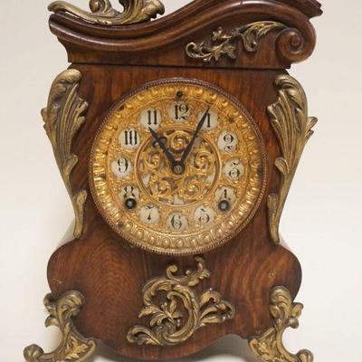 1009	ANSONIA MANTLE CLOCK W A FAUX FINISH METAL CASE, APPROXIMATELY 5 IN X 9 IN X 12 IN
