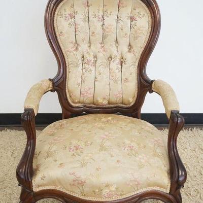 1210	CARVED WALNUT VICTORIAN ARM CHAIR WITH TUFTED BACK, APPROXIMATELY 43 IN H
