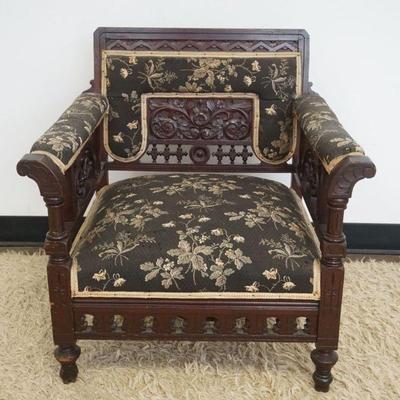 1203	ORNATE CARVED VICTORIAN UPHOLSTERED ARM CHAIR, APPROXIMATELY 27 IN C 24 IN X 28 IN H
