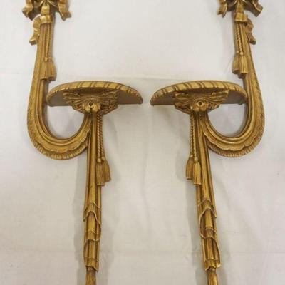 1101	PAIR OF GILT FINISHED COMPOSITE SWAG HANGING WALL SHELVES, EACH APPROXIMATELY 9 IN X 24 IN H

