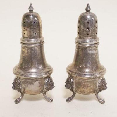 1068	STERLING SILVER POOLE FOOTED SALT & PEPPER SHAKERS WITH EMBOSSED LION HEADS, 4.2 TOZ
