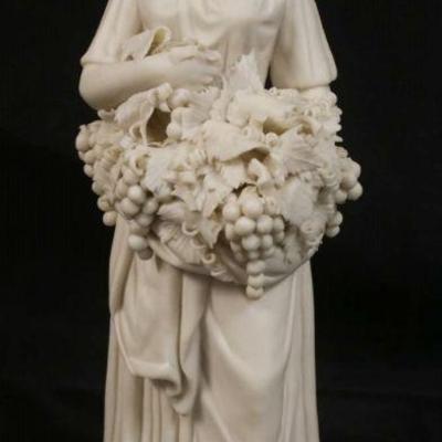 1027	PARIAN FIGURE OF WOMAN HOLDING GRAPE CLUSTERS, APPROXIMATELY 13 1/2 IN HIGH
