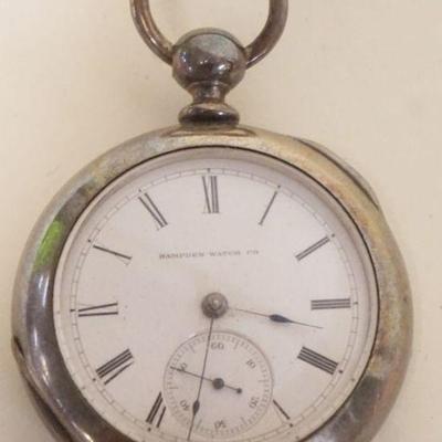 1058	ANTIQUE HAMPDEN POCKET WATCH IN COIN SILVER CASE
