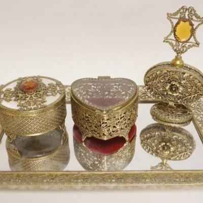 1040	GILT METAL FILIGREE LADY'S DRESSER SET W/JEWELED AMBER GLASS INCLUDING 11 IN X 19 IN MIRRORED TRAY, PERFUME & 2 DRESSER BOXES
