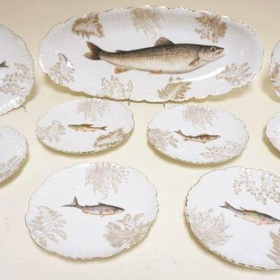 1002	LIMOGES TV FRANCE CHINA FISH PLATTER & PLATES, PLATTER APPROXIMATELY 10 IN X 23 IN W/8 PLATES APPROXIMATELY 9 IN
