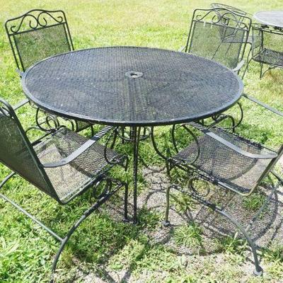 1241	METAL PATIO SET INCLUDING 48 IN ROUND TABLE WITH 4 SPRING CHAIRS
