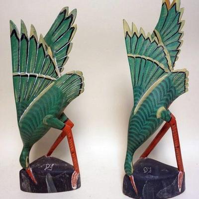 1143	PAIR OF POLYCHROME WOOD CARVED STORKS, ARTIST SIGNED, APPROXIMATELY 25 IN H
