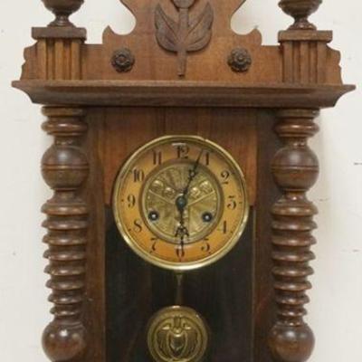 1150	ANTIQUE GERMAN WALL CLOCK WITH CARVED EAGLE ON CREST, APPROXIMATELY 12 IN X 8 IN X 33 IN H
