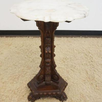1225	SCALLOPED EDGE MARBLE TOP TABLE HAVING CARVED IMAGES OF WOMAN ON ALL 3 SIDES WITH PAW FEET, APPROXIMATELY 20 IN X 31 IN H
