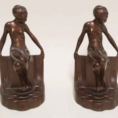 1014	ART NOUVEAU FIGURAL CAST METAL BOOKENDS IN A BRONZE FINISH, SOME WEAR TO FINISH, APPROXIMATELY 4 IN X 5 IN X 8 IN HIGH
