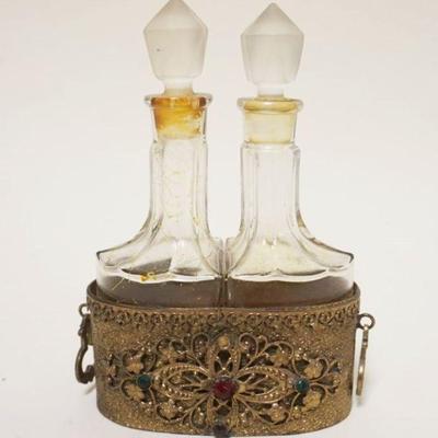 1036	2 GLASS PERFUMES IN JEWELED GILT METAL FILIGREE HOLDER
