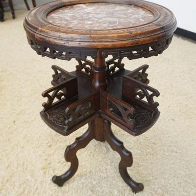 1208	OUTSTANDING WALNUT VICTORIAN STAND WITH INSET BROWN MARBLE TOP AND CARVED REVOLVING TURRET CENTER  SHELF, APPROXIMATELY 19 IN X 31...
