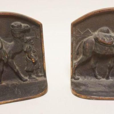 1024	CAST MEATAL CAMEL W/ARAB BOOKENDS, APPROXIMATELY 6 IN X 3 IN X 6 IN HIGH
