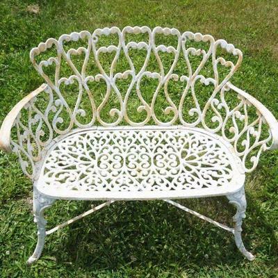 1235	ORNATE CAST IRON GARDEN BENCH WITH HEART SHAPED DESIGN, APPROXIMATELY 37 IN X 19 IN X 30 IN H
