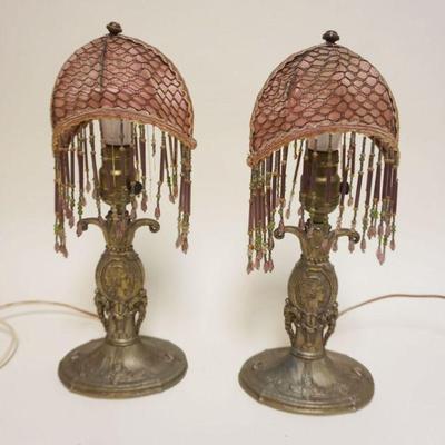 1018	PAIR OF ORNATE CAST METAL BOUDOIR LAMPS, SOME LOSS TO CLOTH SHADES, EACH APPROXIMTELY 18 IN HIGH

