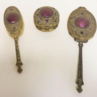 1037	3 PIECE GILT METAL FILIGREE AMYTHEST LADY'S DRESSER SET INCLUDING HAIR BRUSH, MIRROR & ROUND DRESSER BOX
