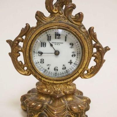 1012	MINIATURE VICTORIAN NEW HAVEN DRESSER CLOCK IN ORNATE CAST METAL CASE, APPROXIMATELY 6 1/2 IN HIGH
