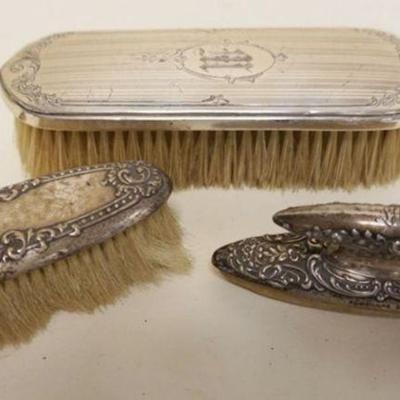1067	STERLING SILVER HANDLED VICTORIAN 3 PC. GROUP OF LADIES DRESSER ITEMS, INCLUDING BRUSHES AND NAIL BUFFER
