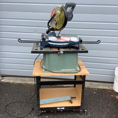 TOSH306 Ryobi 10” Compound Miter Saw	Model TS1352- Double Insulated.  Sits on stand with wheels.  Comes with operating manual.
