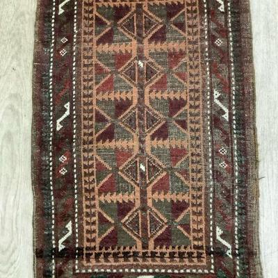TOSH354 Handwoven Rug #6	This small rug is approximately 32" long and 20" wide. It's tones are rich in brown green and...
